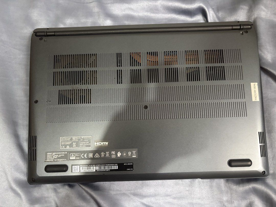MSI Modern 14 14-inch Laptop Intel Core i3 (Category: Laptops & Notebooks) located in Imus. Submitted by migueldcs (Listing ID 1467866029, Image 3). Description: - Brand/Model: MSI Modern 14 (Model MS-14D3) - Color: Sleek Dark Grey - Processor: Intel Core i3 - Manufacture Date: February 2022 - Keyboard: Standard QWERTY layout with a spacious trackpad - Camera: Built-in top bezel webcam - Cooling & Support: Multiple cooling vents and intact rubber