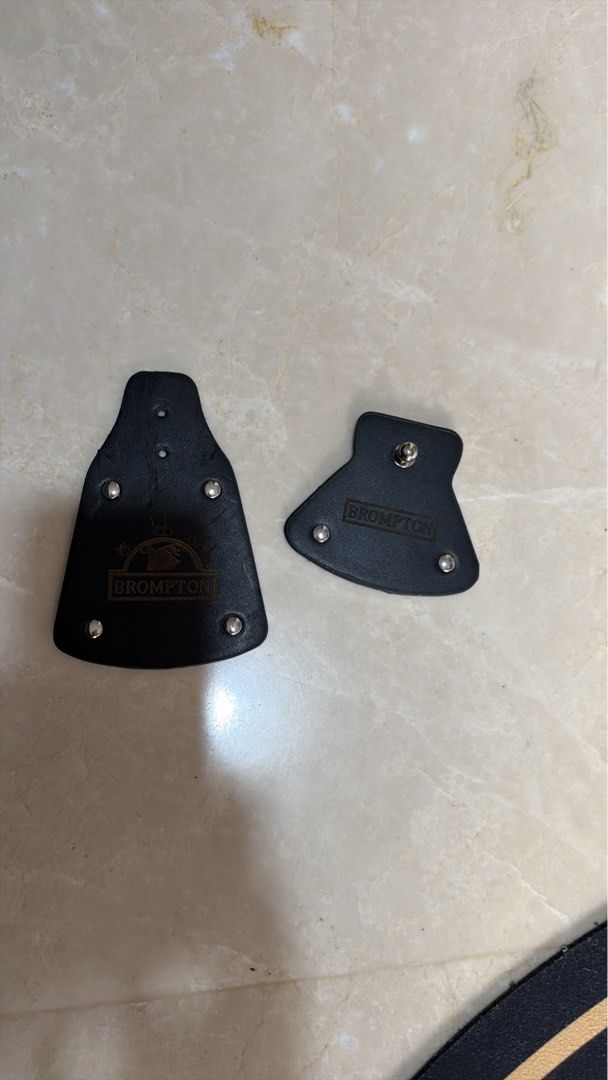 Mud guard flaps for brompton 3sixty java (Category: Parts & Accessories) located in Singapore. Submitted by raysen (Listing ID 1467932500, Image 1). Description: Hey fellow cyclists! Got a set of stylish black leather-look mud guard flaps here, perfect for folding bikes like Brompton, 3Sixty, and Java. Features the classic embossed logo and neat silver stud detailing. - I wanted it as a replacement for my Pline but it was too thick. Please check 