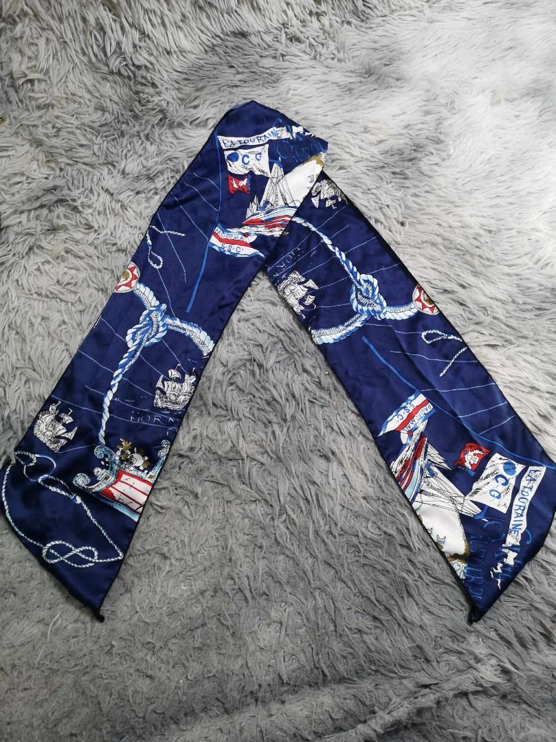 Nautical Themed Print Navy Blue Twilly (Category: Scarves) located in Santa Cruz. Submitted by jmy_surplus.2 (Listing ID 1467969855, Image 1). Description: Size ; L- 5 W - 6.4 Color ; Navy Blue Type ; Twilly Brand ; No Brand Material ; Silk Style ; Navy Blue Neck Ribbon LG 118 JMY 3 Batch #225.