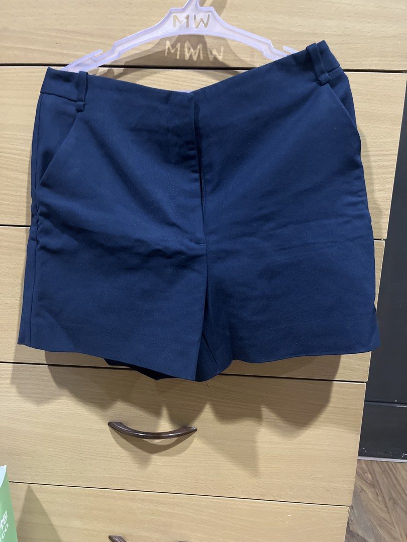 Navy blue tailored shorts with pockets (Category: Shorts) located in Quezon City. Submitted by zinniemon (Listing ID 1467901527, Image 1). Description: - Color: Dark navy blue - Style: tailored shorts - Features: Belt loops, functional side pockets, clean front with hidden zip closure - Versatility: Perfect for casual wear or dressed up for the office - Condition: Clean and ready to wear.