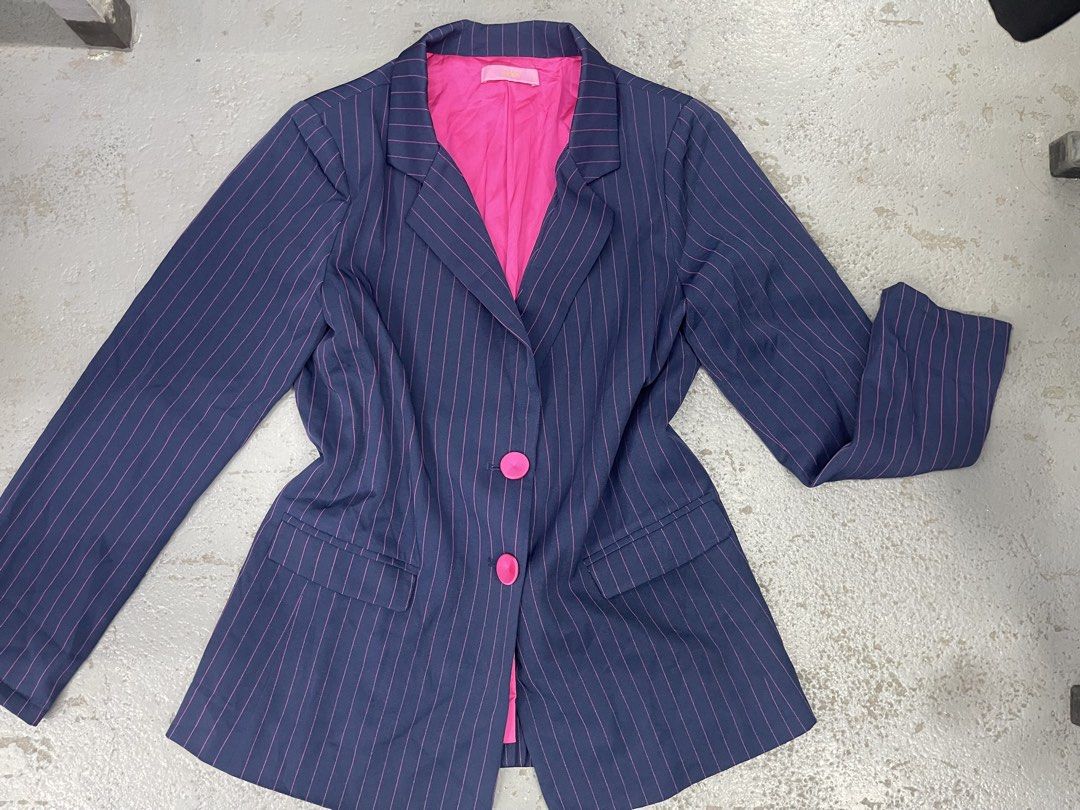 Navy Blue Pinstripe Blazer with Bright Pink Interior (Category: Coats, Jackets and Outerwear) located in Bulacan. Submitted by grazcloset (Listing ID 1467889616, Image 1). Description: - Color: Navy blue with bright pink pinstripes and lining - Closure: Two bright pink front buttons - Pockets: Two functional front flap pockets - Details: Structured lapel collar and long sleeves - Style: Fun, bold statement piece that stands out from standard blaz