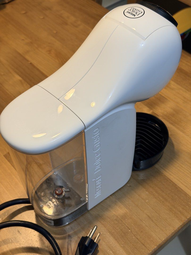 NESCAFÉ Dolce Gusto Genio S (Category: Coffee Machines & Makers) located in Pasig City. Submitted by myprelovedcorner (Listing ID 1467897023, Image 2). Description: Preloved Nescafé Dolce Gusto Genio S * Max Pressure: 15 bar high-pressure pump extraction * Water Tank Capacity: 0.8 liters (removable) * Capsule Bin Capacity: Holds up to 6 used capsules * Voltage: 220V * Dimensions (Genio S Basic): Width: 11.21 cm, Height: 27.32 cm, Depth: 28.65 cm 