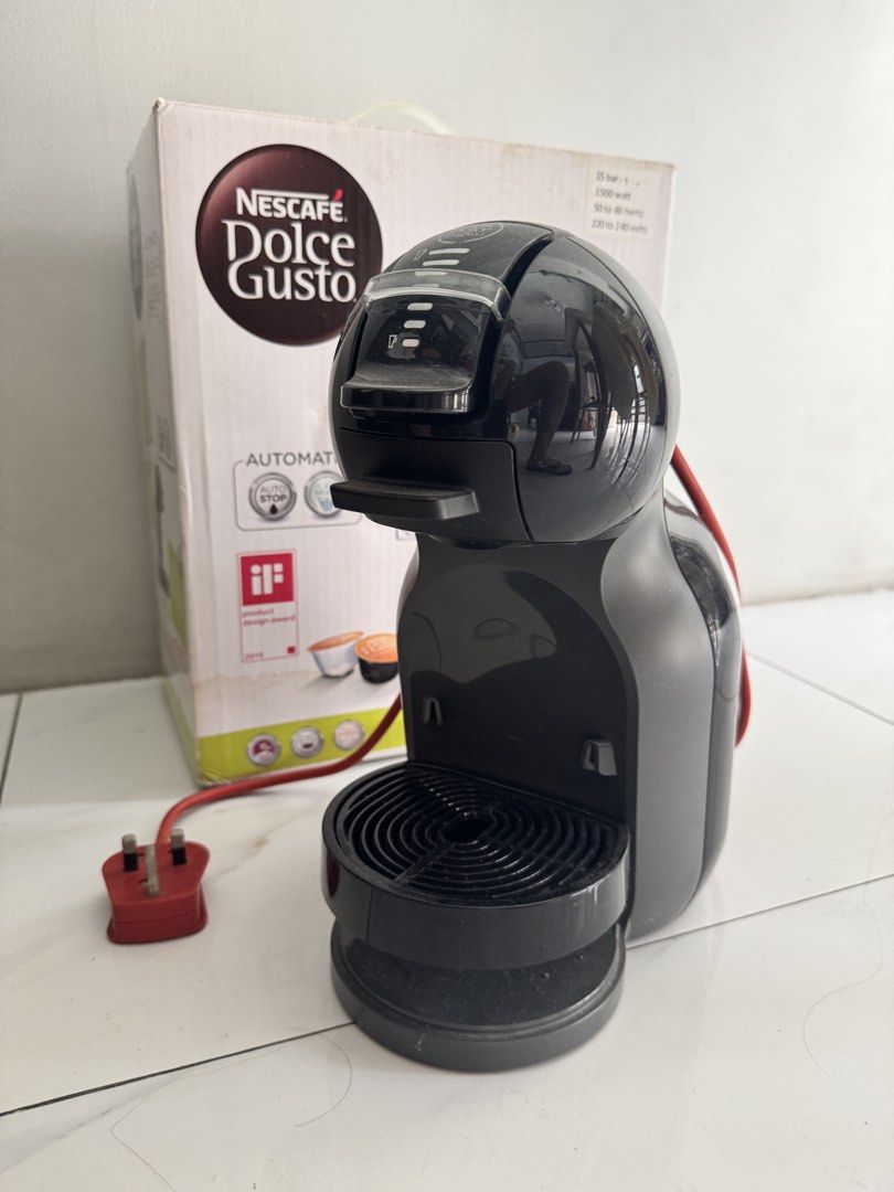 Nescafe Dolce Gusto coffee Machine (Category: Coffee Machines & Makers) located in Pasig City. Submitted by ponyo_ph (Listing ID 1467872058, Image 1). Description: - Model: Nescafe Dolce Gusto Mini Me (Black & Grey) - Condition: Comes with original box - Performance: 15-bar pump pressure, 1500 watts (220-240V) - Power: Red cord with UK 3-pin plug - Bonus: Includes a black wire capsule holder tower loaded with coffee pods - Design: Compact and spa