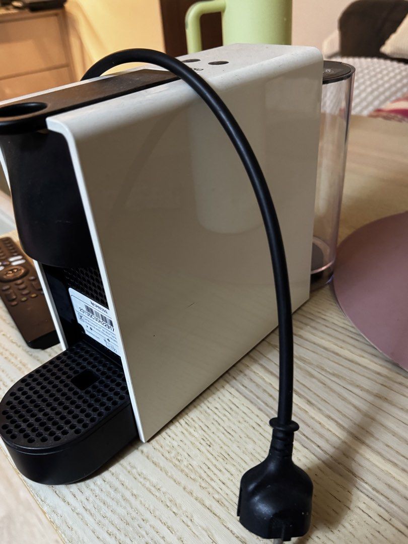 Nespresso Essenza Mini Coffee Machine White (Category: Coffee Machines & Makers) located in Paranaque City. Submitted by keyrends (Listing ID 1467921261, Image 3). Description: White Nespresso Essenza Mini espresso maker. Compact design fits easily on any kitchen counter. Two cup size buttons on top. Clear water tank attached at the back. Power cord with standard plug attached. Removable drip tray and capsule container included..