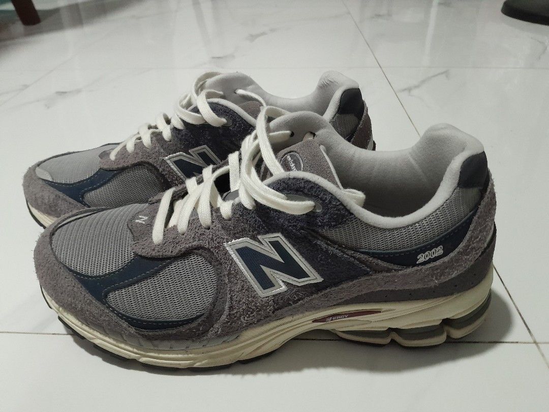 New Balance 2002R Protection Pack Rain Cloud (Category: Sneakers) located in Las Pinas. Submitted by maljun1972 (Listing ID 1467957680, Image 3). Description: - Model: New Balance 2002R Grey - Design: Distressed suede panels with raw edges, grey mesh base, and white laces - Comfort: Cream midsole equipped with N-ergy cushioning - Condition: Worn a few times, minor dirt on soles from normal walking, tread in great shape -With box - Authentic and r