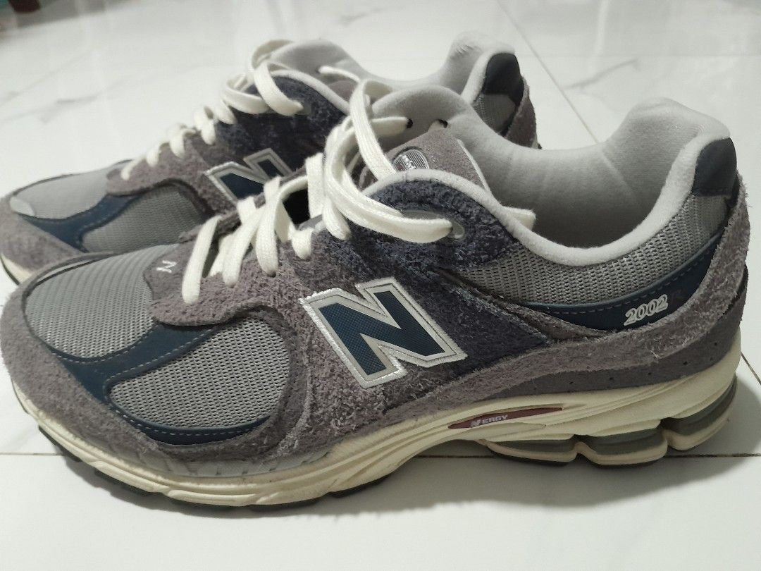 New Balance 2002R Protection Pack Rain Cloud (Category: Sneakers) located in Las Pinas. Submitted by maljun1972 (Listing ID 1467957680, Image 2). Description: - Model: New Balance 2002R Grey - Design: Distressed suede panels with raw edges, grey mesh base, and white laces - Comfort: Cream midsole equipped with N-ergy cushioning - Condition: Worn a few times, minor dirt on soles from normal walking, tread in great shape -With box - Authentic and r