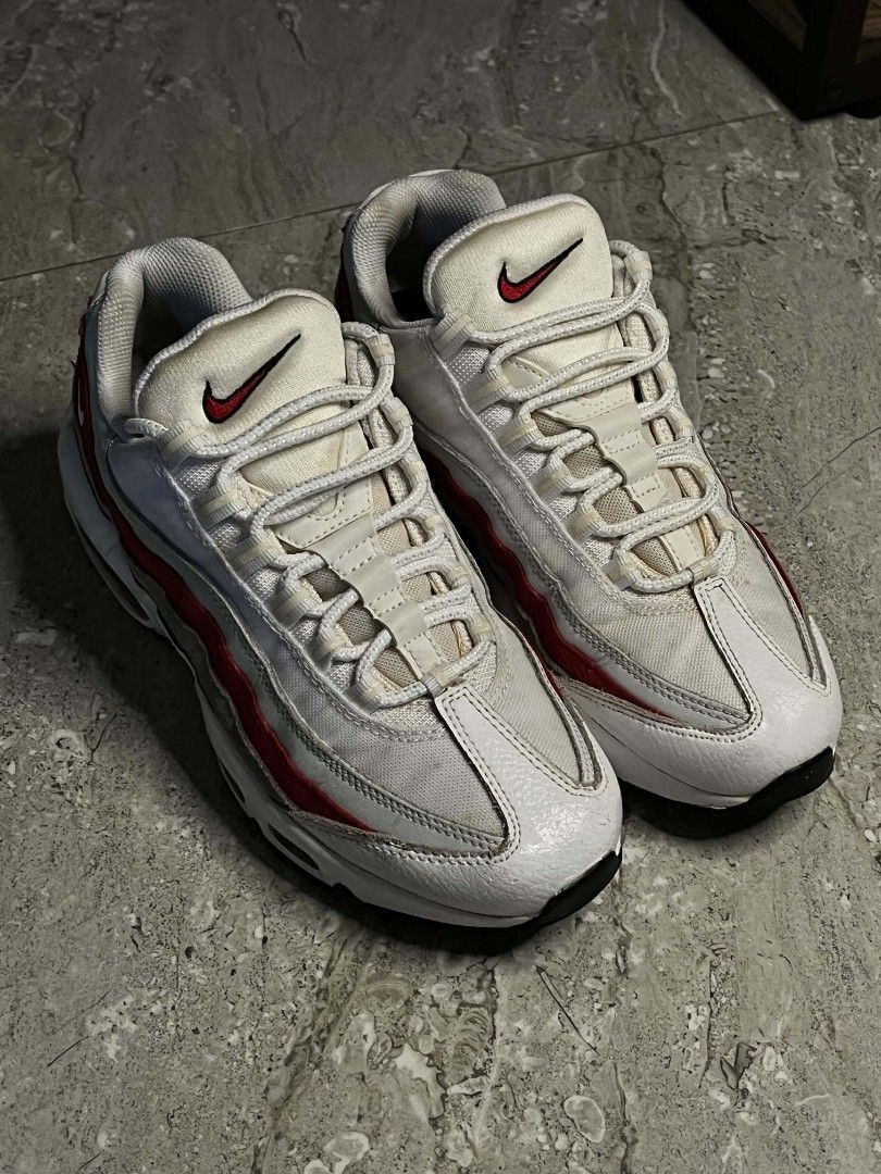 Nike Air Max 95 White Red Grey (Category: Sneakers) located in Manila. Submitted by stephen_thrift (Listing ID 1467949788, Image 1). Description: - Brand: Nike - Model: Air Max 95 - Colorway: White, Grey, and Red - Design: Iconic layered upper with red branding on the tongue and side heel - Soles: Visible air units in the midsole - Closure: Standard lace-up with rope laces - Condition: Clean overall appearance with minimal signs of wear.
