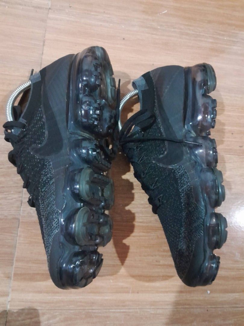 Nike Air VaporMax Flyknit Black (Category: Sneakers) located in Calamba. Submitted by ysabellascloset17 (Listing ID 1468017487, Image 2). Description: - Brand: Nike Air VaporMax Flyknit - Color: Triple Black - Upper Material: Lightweight and breathable Flyknit - Closure: Classic lace-up - Cushioning: Signature full-length translucent air pods - Details: VaporMax branding on the heel counter - Condition: Clean, with minimal wear on treads.