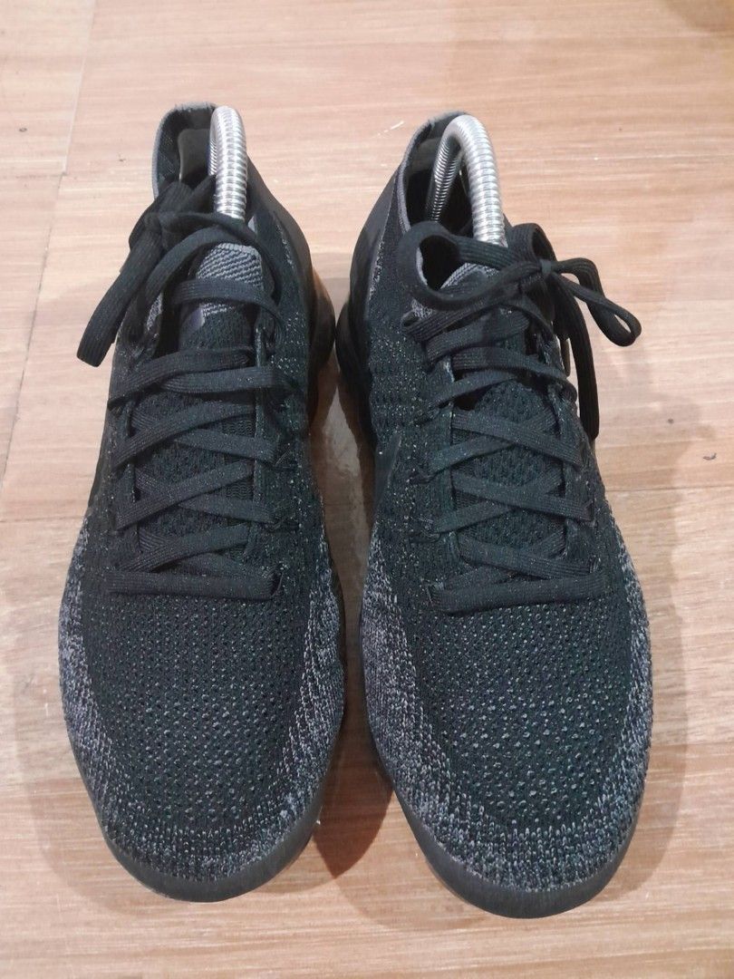 Nike Air VaporMax Flyknit Black (Category: Sneakers) located in Calamba. Submitted by ysabellascloset17 (Listing ID 1468017487, Image 3). Description: - Brand: Nike Air VaporMax Flyknit - Color: Triple Black - Upper Material: Lightweight and breathable Flyknit - Closure: Classic lace-up - Cushioning: Signature full-length translucent air pods - Details: VaporMax branding on the heel counter - Condition: Clean, with minimal wear on treads.