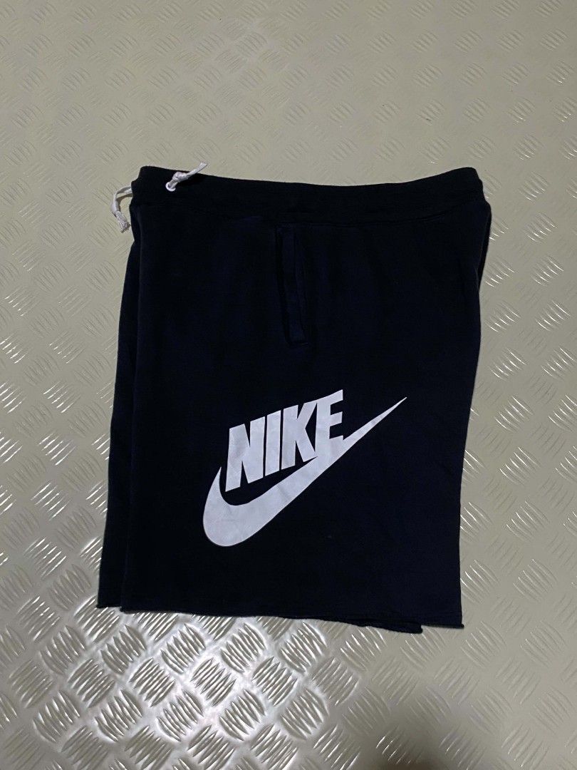 Nike Alumni XL (Category: Shorts) located in Dipolog. Submitted by just_thriftfinds (Listing ID 1467847304, Image 1). Description: - Brand: Nike - Item: Fleece Shorts - Size: XL - Color: Black with large white logo on left leg - Material: Cotton and polyester blend (Made in Thailand) - Features: Elastic waistband with adjustable white drawstring, side pockets, single back pocket - Condition: Excellent / Pre-loved - Best for: Lounging, gym workout