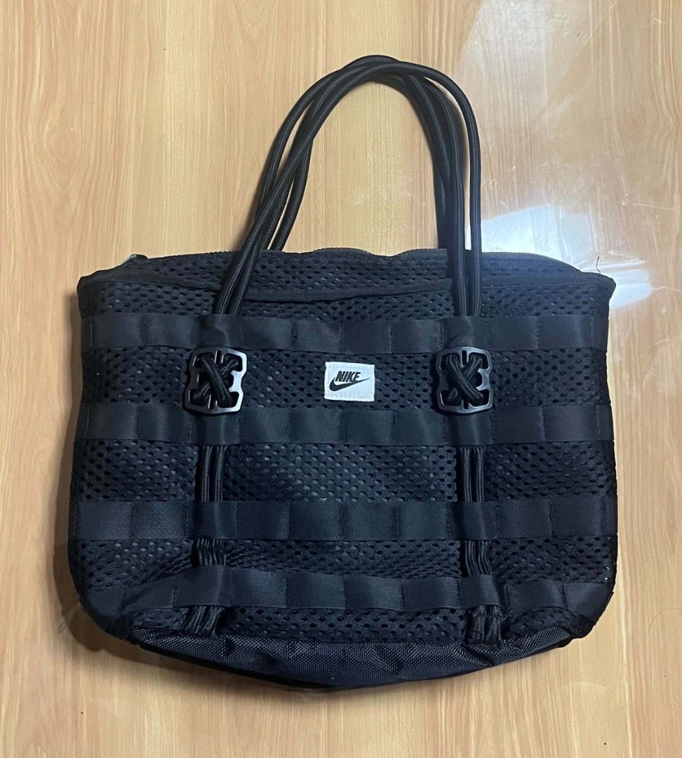 Nike Black Mesh Utility Tote Bag (Category: Tote Bags) located in Manila. Submitted by senggggg. (Listing ID 1468028108, Image 1). Description: good condition working zip no hidden issue check details and size.