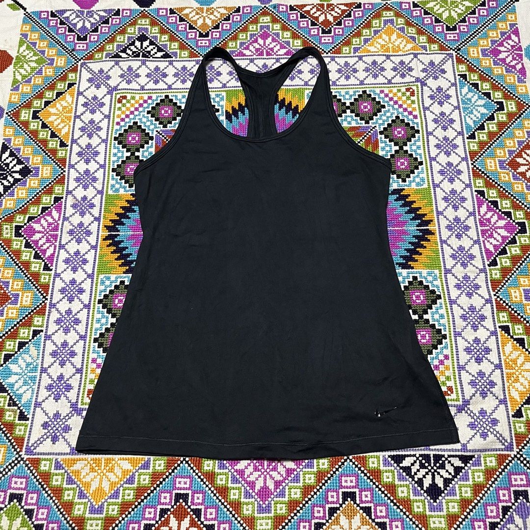 Nike Black Racerback Athletic Tank Top (Category: Activewear) located in Dagupan City. Submitted by vernzkee (Listing ID 1467867182, Image 1). Description: - Brand: Nike - Item: Athletic Tank Top - Color: Black - Design: Racerback with reflective swoosh logo near bottom hem - Material: Soft, stretch fabric ideal for running, gym, or casual wear - Dimensions: 15.5" pit-to-pit, 25.5" length - Condition: Excellent, clean with no stains or holes Loca