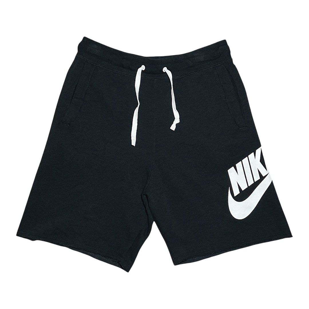 Nike Black Shorts with White Logo Size M (Category: Shorts) located in Naga. Submitted by lootersfinder (Listing ID 1467974720, Image 2). Description: - Brand: Nike - Style Code: AR2376-010 - Size: Medium (M) - Color: Black with large white swoosh logo - Material: 58% Cotton, 23% Rayon (cotton blend) - Features: Elastic waistband with white drawstring cords, convenient side pockets - Condition: Brand new with tags.