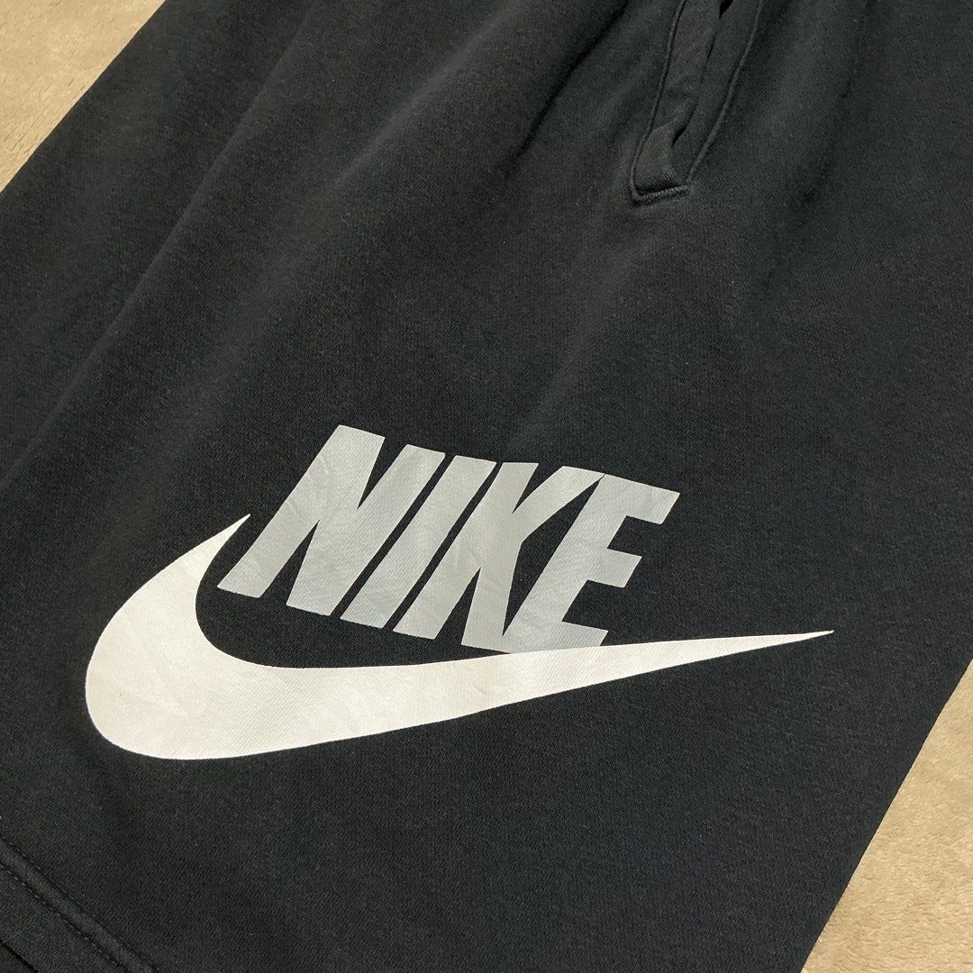 Nike Black Sweatshorts with Logo (Category: Shorts) located in Naga. Submitted by eunhasowon12391 (Listing ID 1467972335, Image 3). Description: - Brand: Nike - Color: Black with grey and white logo - Size: Large logo printed on lower left leg - Features: Adjustable drawstring waistband, convenient side pockets - Condition: Minor wear on the logo print and slight fraying on the inner waistband lining (as pictured) - Ideal for lounging, gym, or ca