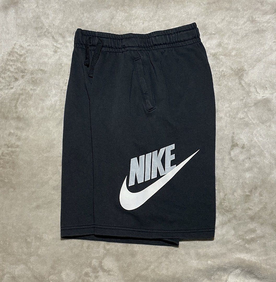 Nike Black Sweatshorts with Logo (Category: Shorts) located in Naga. Submitted by eunhasowon12391 (Listing ID 1467972335, Image 2). Description: - Brand: Nike - Color: Black with grey and white logo - Size: Large logo printed on lower left leg - Features: Adjustable drawstring waistband, convenient side pockets - Condition: Minor wear on the logo print and slight fraying on the inner waistband lining (as pictured) - Ideal for lounging, gym, or ca