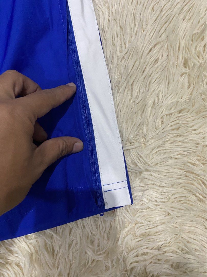 Nike Blue White Stripe Track Pants Size M (Category: Joggers) located in Manila. Submitted by switchcity (Listing ID 1467878766, Image 2). Description: - Brand: Nike - Style: Track pants with white side stripes - Color: Vibrant blue - Size: Medium (tagged) - Origin: Made in Vietnam - Features: Elastic waistband with adjustable drawstring, breathable mesh lining, and convenient ankle zippers for a custom fit - Condition: Excellent.