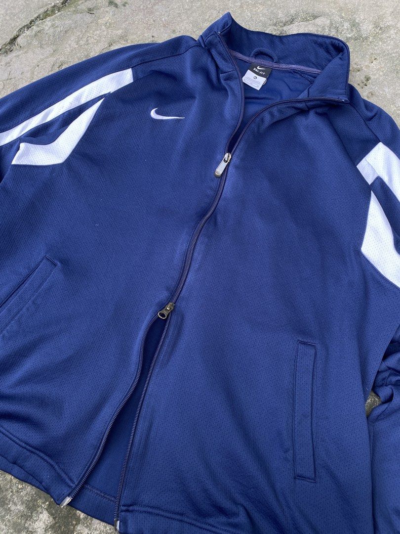 Nike Dri-fit Track Jacket (Category: Coats, Jackets and Outerwear) located in Manila. Submitted by zefrylle_co (Listing ID 1467925253, Image 3). Description: - Excellent condition - No issue - Double zip - Embroidered logo - Ready to wear - L - XL DM to purchase!.