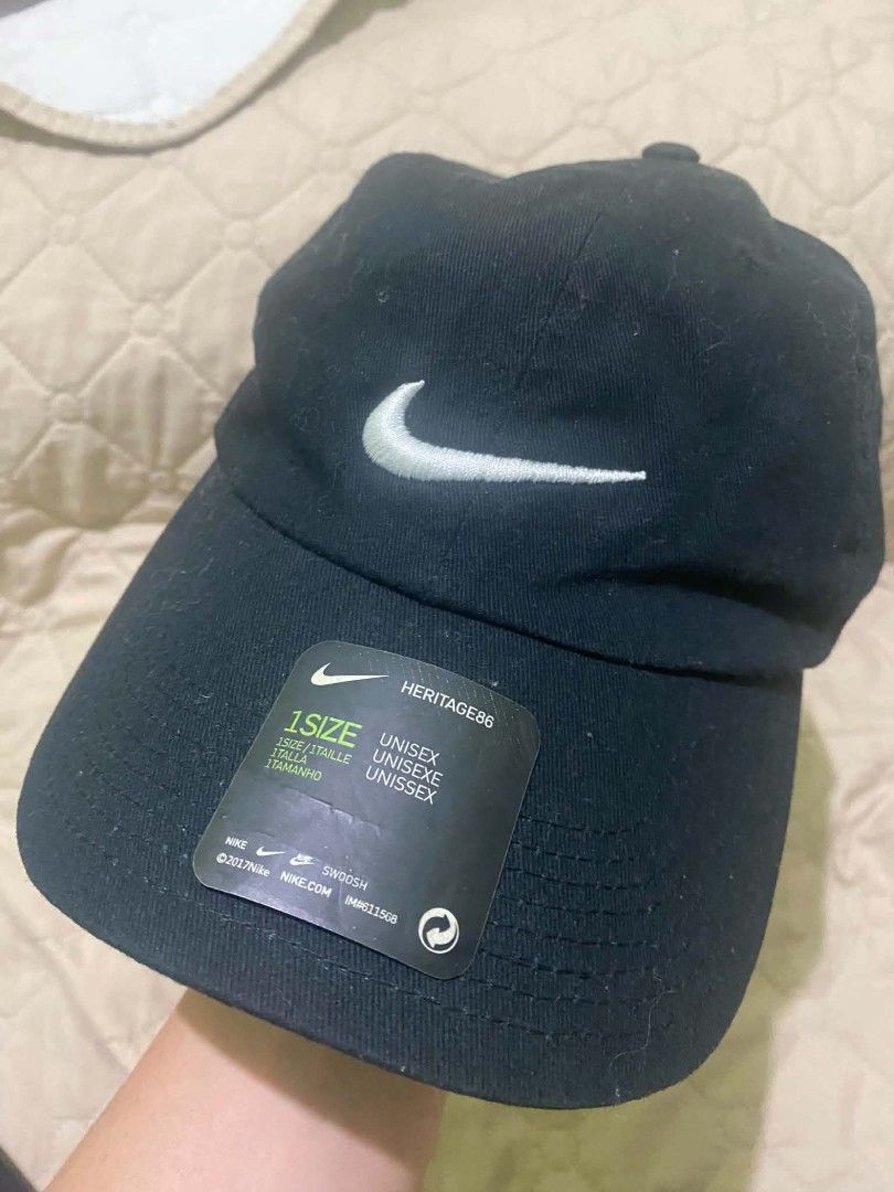Nike Heritage86 Black Cap (Category: Caps & Hats) located in Quezon City. Submitted by elihur.tuazon (Listing ID 1467885316, Image 2). Description: - Brand: Nike - Model: Heritage86 Cap - Color: Black with white embroidered Swoosh - Condition: Brand new with original tags attached - Closure: Adjustable strapback with metal buckle - Size: One size fits most (Unisex).