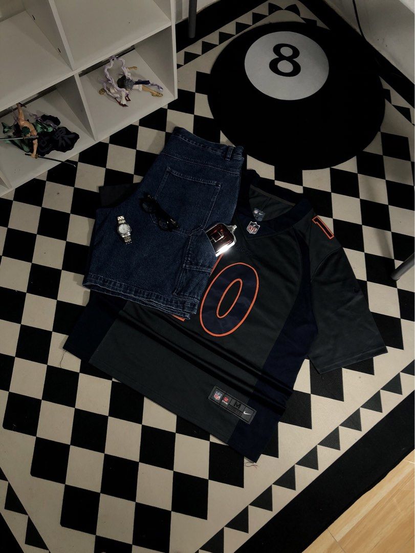 Nike Jersey Grey Size Medium. Dimes: 23X31.5 (Category: Activewear) located in Manila. Submitted by ejaay_2012 (Listing ID 1467867144, Image 1). Description: - Authentic Nike On Field Denver Broncos jersey - Player: Jeudy (#10) - Colorway: Navy blue and grey with orange numbers and lettering - Size: Medium (tag on hem) - Features: Stitched numbers/letters, NFL shield at v-neck - Condition: Clean fabric, great for game days or streetwear.