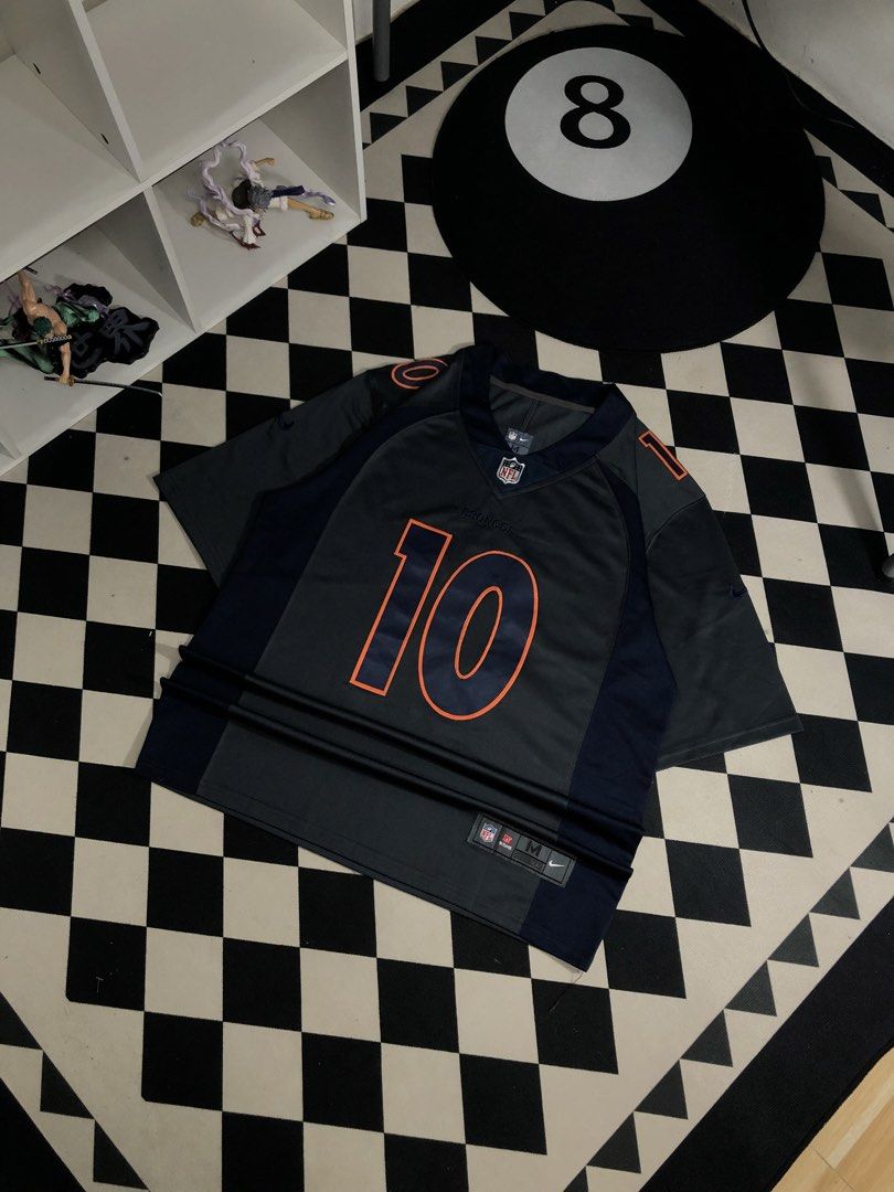 Nike Jersey Grey Size Medium. Dimes: 23X31.5 (Category: Activewear) located in Manila. Submitted by ejaay_2012 (Listing ID 1467867144, Image 2). Description: - Authentic Nike On Field Denver Broncos jersey - Player: Jeudy (#10) - Colorway: Navy blue and grey with orange numbers and lettering - Size: Medium (tag on hem) - Features: Stitched numbers/letters, NFL shield at v-neck - Condition: Clean fabric, great for game days or streetwear.