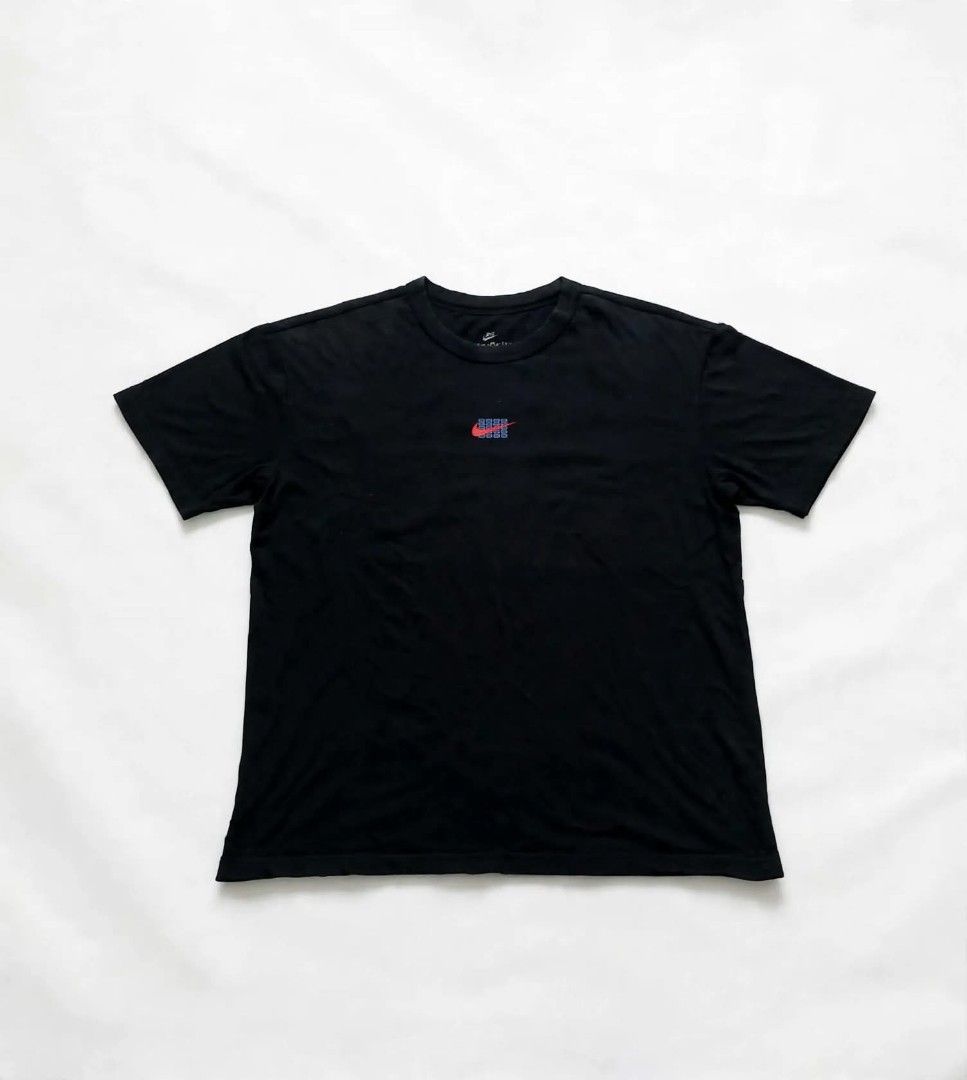Nike Just Do It Graphic T-Shirt Black Tee (Category: Tshirts & Polo Shirts ) located in Aguinaldo. Submitted by ukayandthrift (Listing ID 1467934302, Image 2). Description: - Brand: Nike - Style Code: FJ7725-010 - Color: Black - Size: Large - Material: Standard fit cotton - Design: Small chest logo, bold Japanese script grid graphic on the back - Condition: Clean and intact print with minor wear on the inner neck tag.