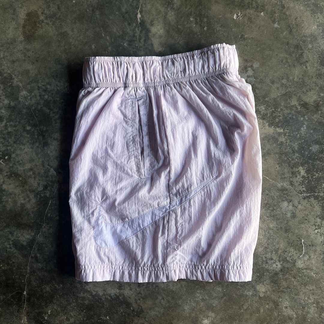 Nike Light Purple Shorts Size S (Category: Shorts) located in M'Lang. Submitted by alexpabillo0324 (Listing ID 1467924640, Image 2). Description: - Brand: Nike - Style/Color: Light Purple (Style Code: DM6740-511) - Size: Women's Small - Material: Lightweight crinkled nylon shell with breathable mesh lining - Fit & Features: Wide elastic waistband, adjustable drawcord, and two convenient side slip pockets - Design: Large printed Nike Swoosh graphi