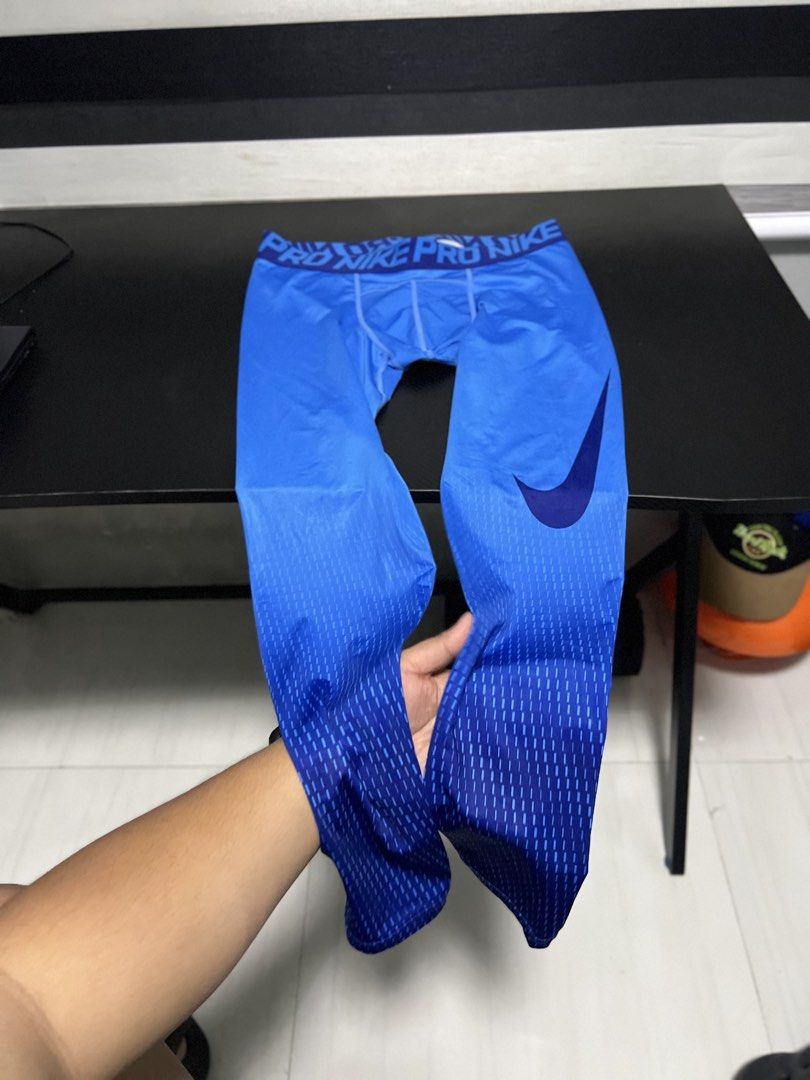 Nike Pro Blue Compression Tights Size L (Category: Activewear) located in Calasiao. Submitted by pb.supply_v2 (Listing ID 1468050742, Image 2). Description: Bright blue Nike Pro compression tights in size Large. Gradient pattern running down the legs with a signature swoosh logo. Elastic waistband featuring repeated Nike Pro branding. Made from breathable polyester and spandex blend. Great athletic wear for workouts, running, or gym sessions..