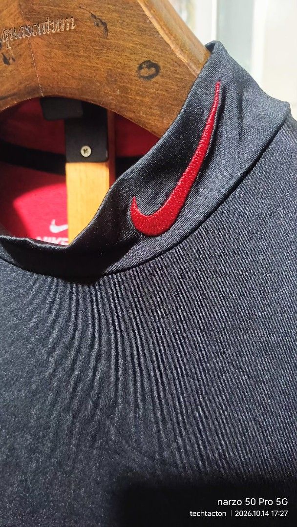 Nike Pro Combat Dri-Fit Fitted (Category: Activewear) located in Santo Tomas. Submitted by pickers_corner (Listing ID 1468021239, Image 3). Description: NIKE Pro Combat Fit size S dime 17x27 excellent condition - Brand: Nike Pro Combat - Style: Dri-Fit long sleeve shirt with mock neck - Color: Black with red side panels and red embroidered swoosh - Size: Small (Fitted) - Details: Flatlock stitching, includes inner care and product tags - Conditio