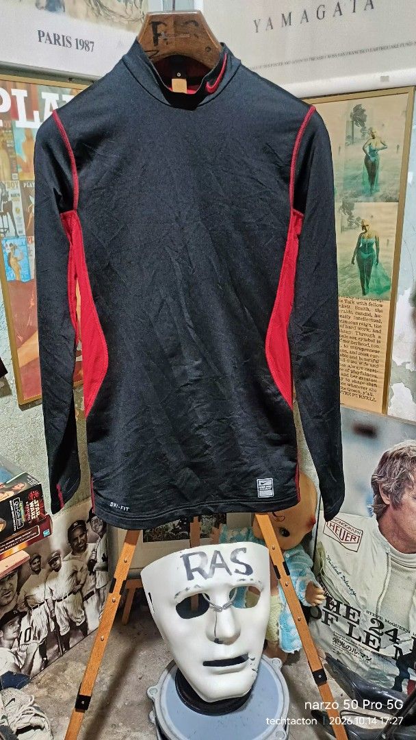 Nike Pro Combat Dri-Fit Fitted (Category: Activewear) located in Santo Tomas. Submitted by pickers_corner (Listing ID 1468021239, Image 1). Description: NIKE Pro Combat Fit size S dime 17x27 excellent condition - Brand: Nike Pro Combat - Style: Dri-Fit long sleeve shirt with mock neck - Color: Black with red side panels and red embroidered swoosh - Size: Small (Fitted) - Details: Flatlock stitching, includes inner care and product tags - Conditio