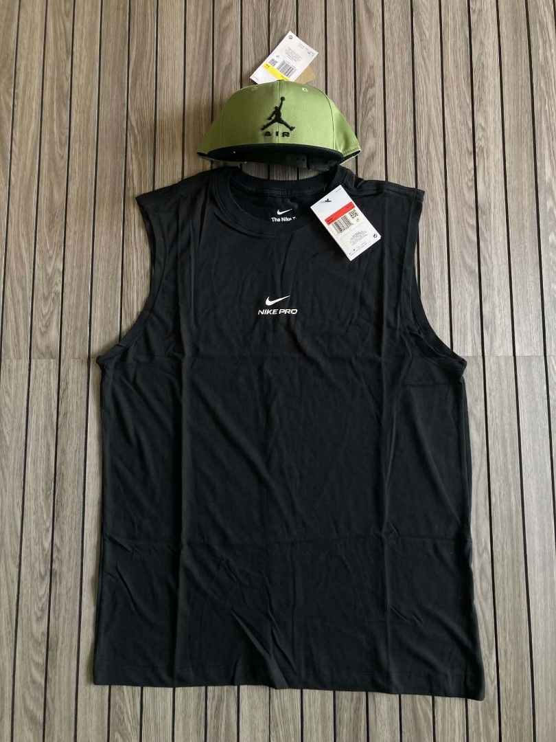 Nike Pro Training Tank Top Black Men's Size L (Category: Activewear) located in Trece Martires City. Submitted by djaothriftshop (Listing ID 1467886814, Image 2). Description: - Brand: Nike Pro - Style: Training sleeveless top - Color: Classic black - Neckline: Crew neck with small chest branding - Material: 57% cotton, 43% polyester - Origin: Made in Egypt - Condition: Brand new with original store tags attached.
