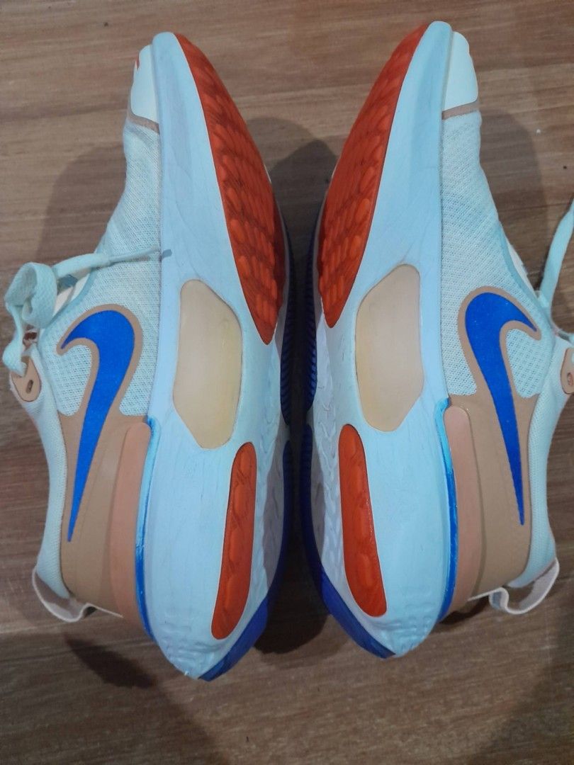 Nike React Miler Running Shoes White Orange Blue (Category: Sneakers) located in Calamba. Submitted by ysabellascloset17 (Listing ID 1468018355, Image 2). Description: - Brand: Nike React Miler - Colorway: White, orange, and blue - Upper: Breathable mesh with secure lace-up closure - Midsole: Cushioned React foam for all-day comfort - Outsole: Durable textured rubber with high-traction pods - Condition: Normal signs of wear on soles, overall grea
