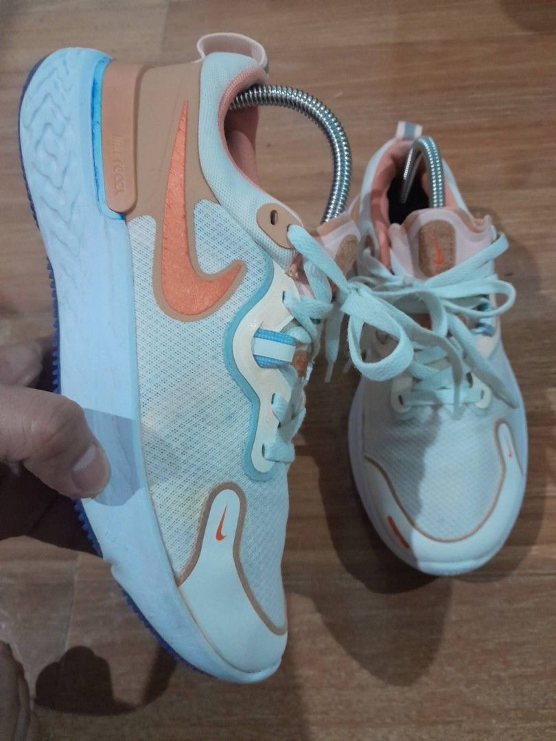 Nike React Miler Running Shoes White Orange Blue (Category: Sneakers) located in Calamba. Submitted by ysabellascloset17 (Listing ID 1468018355, Image 1). Description: - Brand: Nike React Miler - Colorway: White, orange, and blue - Upper: Breathable mesh with secure lace-up closure - Midsole: Cushioned React foam for all-day comfort - Outsole: Durable textured rubber with high-traction pods - Condition: Normal signs of wear on soles, overall grea