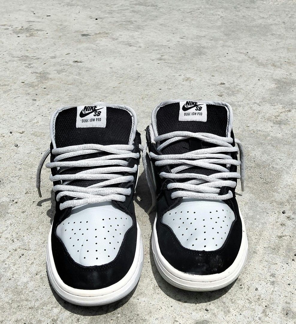 Nike SB Dunk Low Pro Black Grey (Category: Sneakers) located in Iloilo. Submitted by yoleomf6969 (Listing ID 1467882948, Image 3). Description: - Brand/Model: Nike SB Dunk Low Pro - Colorway: Classic Black and Grey - Details: Padded tongue with Nike SB tag and chunky grey laces - Condition: Clean overall shape, grippy outsoles, and light scuffing on the toes of the white midsoles - Versatility: Great for both skating and everyday casual wear.