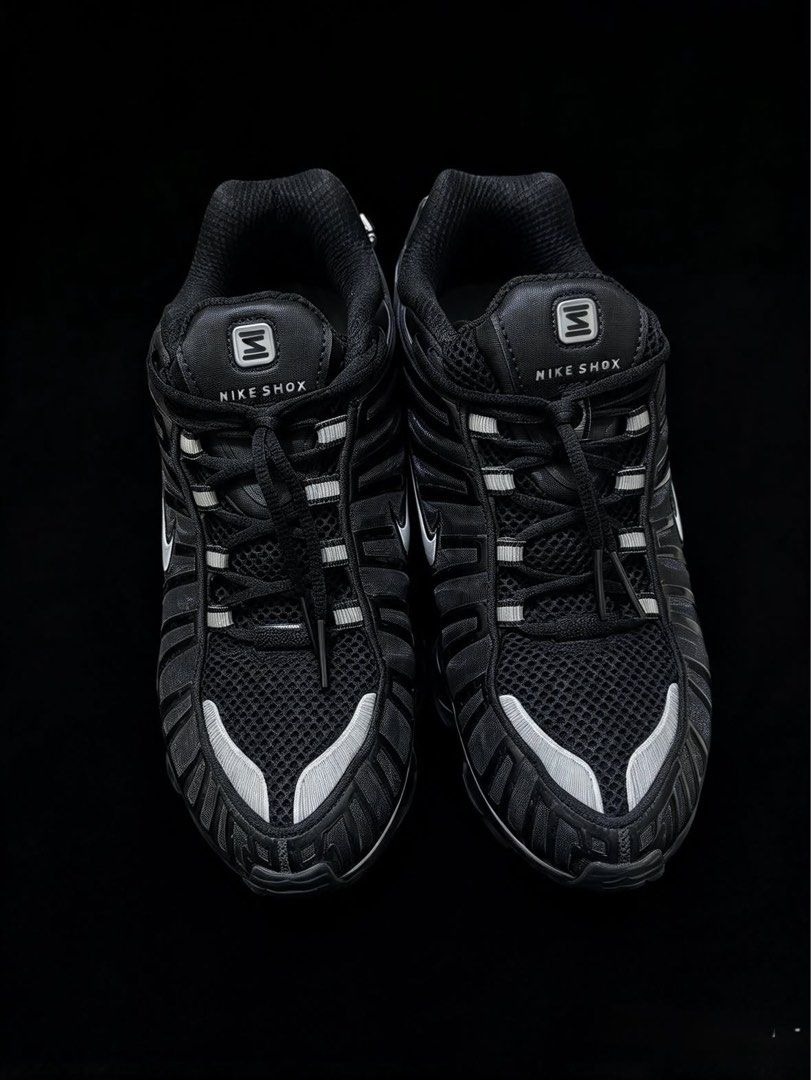 Nike Shox TL Black Metallic Silver (Category: Sneakers) located in Las Pinas. Submitted by 2fly.margiela (Listing ID 1467871186, Image 1). Description: - Model: Nike Shox TL - Colorway: Black and Metallic Silver - Cushioning: Iconic full-length Shox columns for maximum impact absorption - Design: Breathable mesh upper, glossy TPU cage overlays, and reflective details on toe and lace loops - Branding: Classic Swoosh on sides and Shox logo on tongu