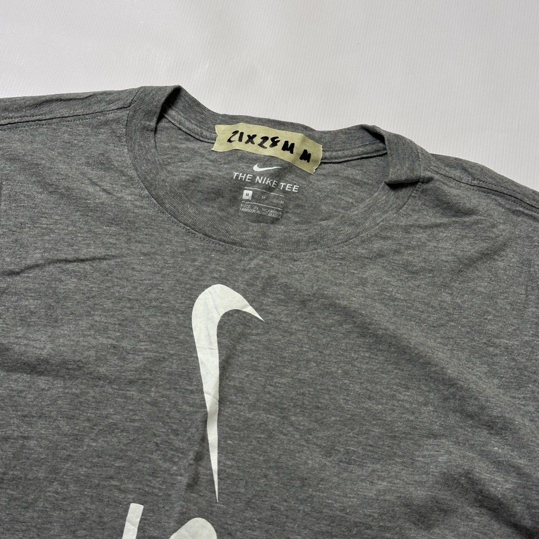 Nike The Nike Tee Gray T-Shirt Medium (Category: Tshirts & Polo Shirts ) located in Gapan. Submitted by rasthriftshop17 (Listing ID 1467989895, Image 2). Description: Size on tag: M Dimes: 21 x 28 Condition: Excellent Color rate: 9/10 Issue: None.