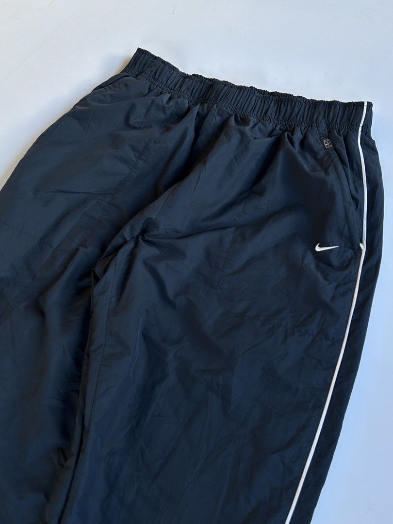 Nike track pants (Category: Joggers) located in Dasmarinas. Submitted by lencianola35953 (Listing ID 1467944779, Image 2). Description: waist: 28-42 length: 41 hem: 7.5 color rate: 9/10 no issue.