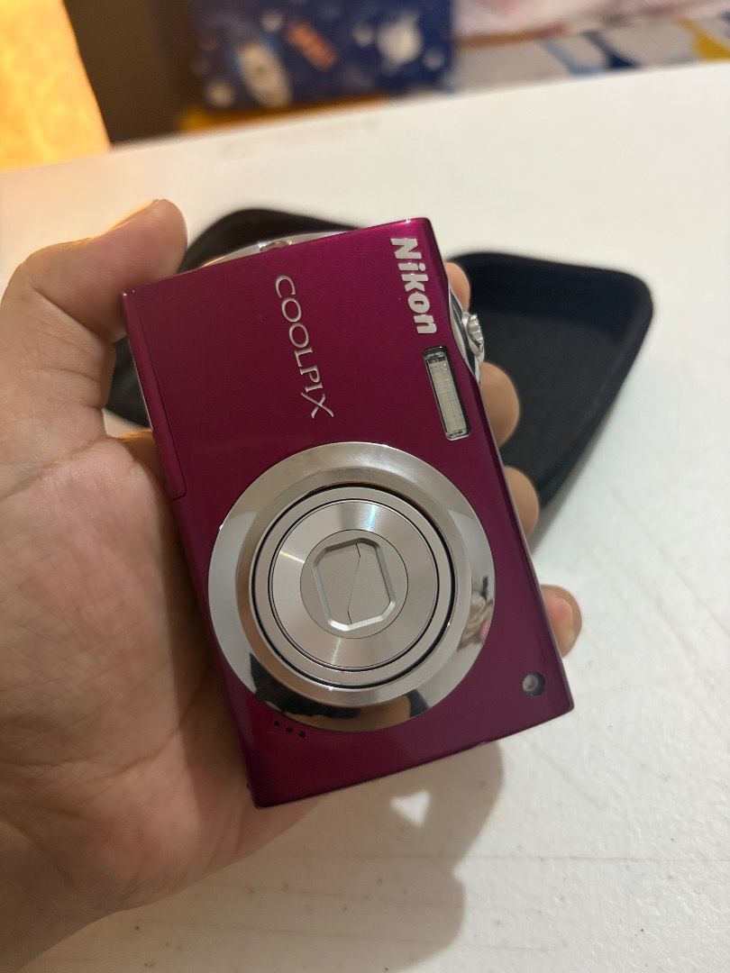 Nikon Coolpix S4000 (Category: Cameras) located in Bay. Submitted by zopiah_camera (Listing ID 1467981160, Image 1). Description: - Pink Nikon Coolpix S4000 digital camera, works great and perfect for Y2K aesthetic shots - Includes matching black hard case for protection and portability - Comes with original Nikon battery pack, power adapter, USB cable, and charging block - Includes a SanDisk 2GB SD card so you can start shooting immediately .
