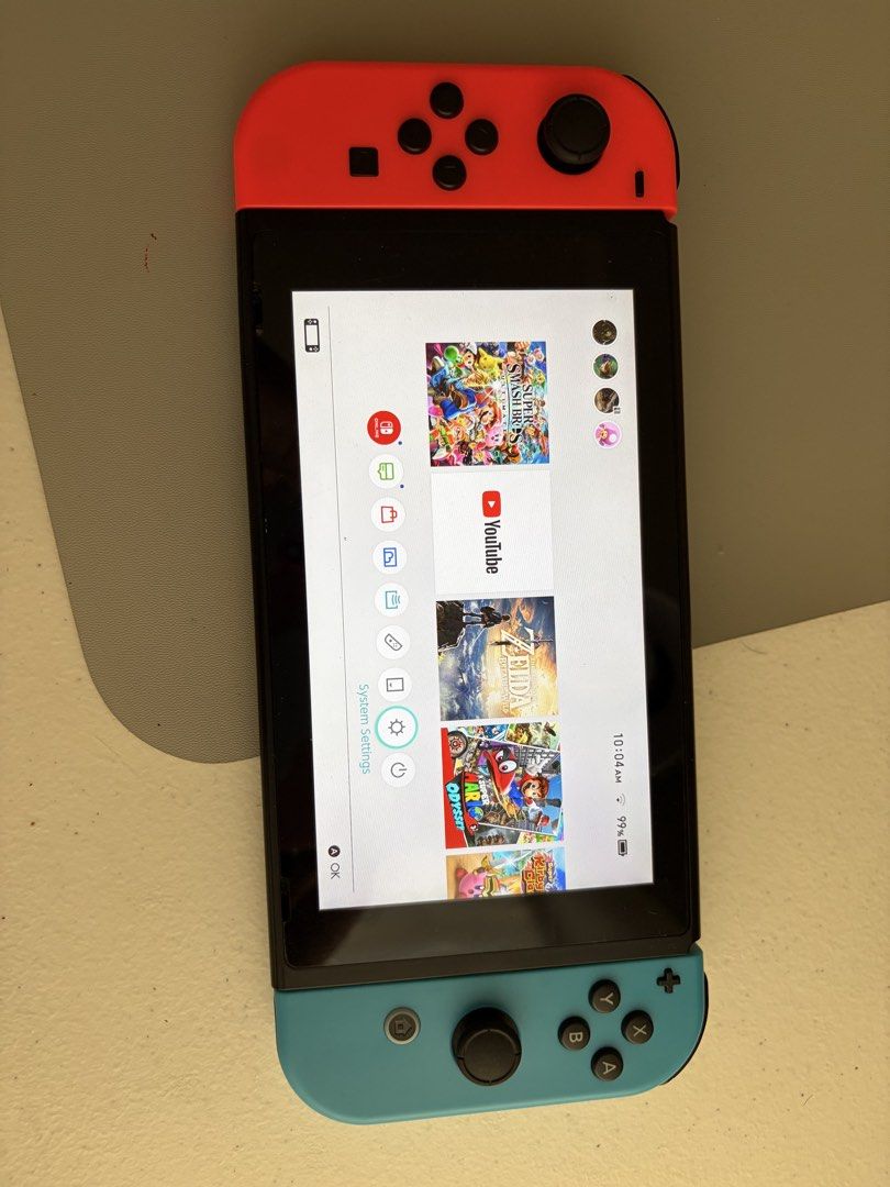 Nintendo Switch Console with Red Carry Case (Category: Nintendo) located in Butuan. Submitted by labolic (Listing ID 1467938464, Image 2). Description: - Nintendo Switch console with vibrant Neon Red and Blue Joy-Cons - Excellent working condition with a pristine, scratch-free screen - Serial numbers match the system settings for authenticity - Includes a collectible Super Mario Odyssey themed red carrying case - Comes with a 110 GB microSD card 
