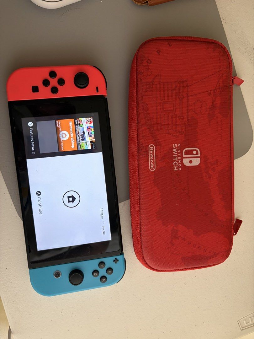 Nintendo Switch Console with Red Carry Case (Category: Nintendo) located in Butuan. Submitted by labolic (Listing ID 1467938464, Image 1). Description: - Nintendo Switch console with vibrant Neon Red and Blue Joy-Cons - Excellent working condition with a pristine, scratch-free screen - Serial numbers match the system settings for authenticity - Includes a collectible Super Mario Odyssey themed red carrying case - Comes with a 110 GB microSD card 