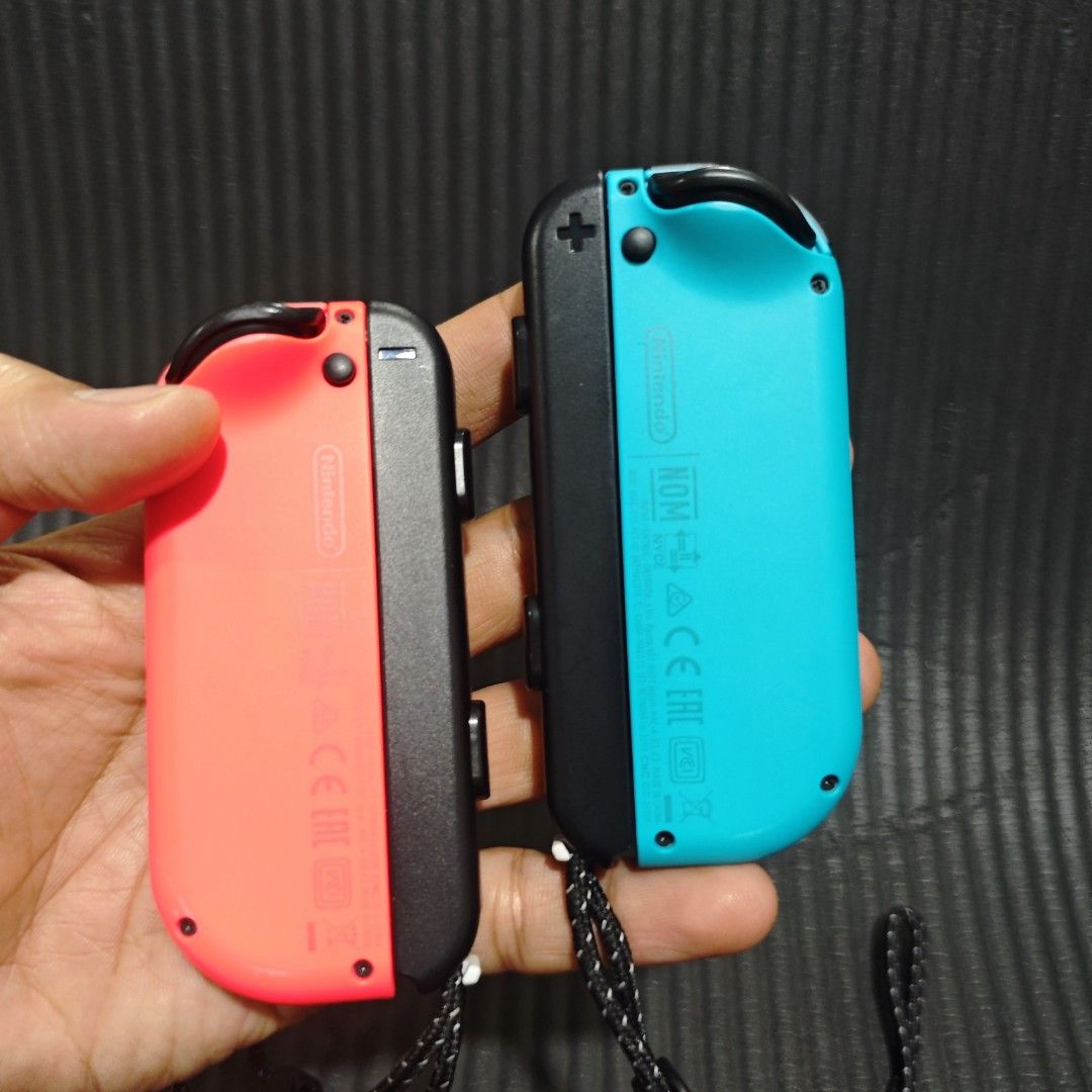 Nintendo Switch Joycon Neon Blue and Red Original (Category: Controllers) located in Quezon City. Submitted by shopme_gadget30 (Listing ID 1467998243, Image 2). Description: kindly read the details first for sale fixed price Good Condition tested and working no drifting all buttons working compatible to Nintendo switch v1/v2/ or oled original with strap qc area meet up: sm north shipping fee must shoulder by the buyer via lalamove or grab payment