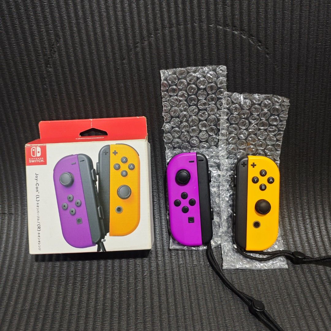 Nintendo Switch Joycon Original (Category: Controllers) located in Quezon City. Submitted by shopme_gadget30 (Listing ID 1467998063, Image 1). Description: kindly read the details first for sale fixed price Good Condition tested and working no drifting all buttons working with minor scratches only compatible to Nintendo switch v1/v2/ or oled original neon purple and neon orange but in reading is white with strap with box qc area meet up: sm north
