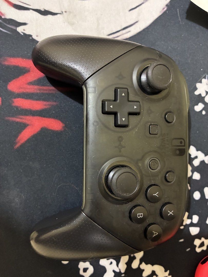 Nintendo Switch Pro Controller Black (Category: Controllers) located in Malabon City. Submitted by iamxhiiin (Listing ID 1468050383, Image 1). Description: - Item: Nintendo Switch Pro Controller (Black) - Condition: Used, fully functional, minor scuffs and dust from regular use - Features: Standard layout, dual thumbsticks, D-pad, face buttons, textured grips - Connectivity: Wireless pad ready to pair with your console.