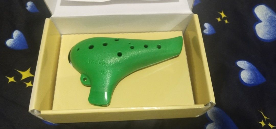 Noble Ocarina Plastic AC Multi-Chamber Set (Category: Musical Instruments) located in Muntinlupa City. Submitted by grayfox05 (Listing ID 1467964771, Image 2). Description: - Set of 2 plastic AC ocarinas in green and black - Lightweight and durable synthetic resin material, perfect for beginners and practice - Black ocarina comes with a purple neck lanyard attached - Includes original boxes and instruction pamphlets for both units - Condition: Gr