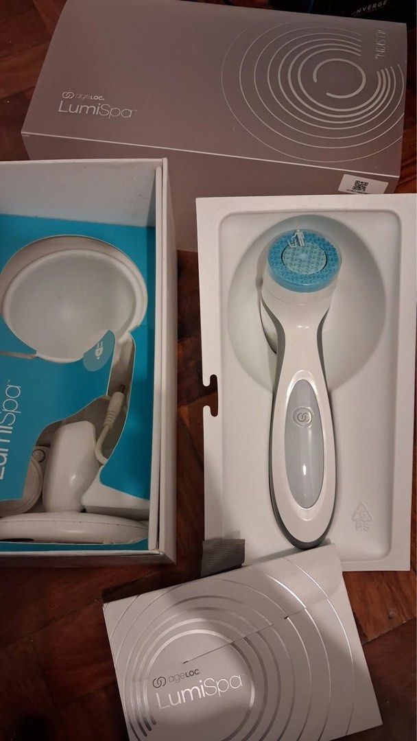 Nu Skin ageLOC LumiSpa Cleansing Device (Category: Face Care) located in Quezon City. Submitted by thrifteesph930 (Listing ID 1467845657, Image 1). Description: - Authentic Nu Skin ageLOC LumiSpa skin cleansing device (White & Grey) - Includes charging stand, power cord, and original box - Comes with a gentle, soft blue silicone treatment head - Easy one-touch button control for effortless daily cleansing.