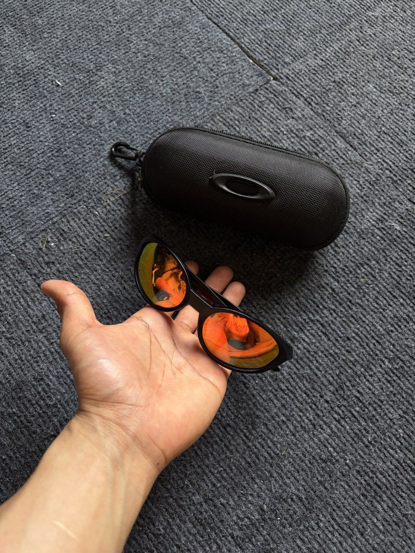 Oakley Jacket (inspired) Sunglasses (Category: Sunglasses & Eyewear) located in Manila. Submitted by toys_hats005 (Listing ID 1467960721, Image 3). Description: - Brand: Oakley - Frame Color: Black - Lenses: Reflective orange, clean with no major scratches - Inclusion: Original hard zippered case with metal ellipse logo and carabiner clip - Condition: Ready to wear.