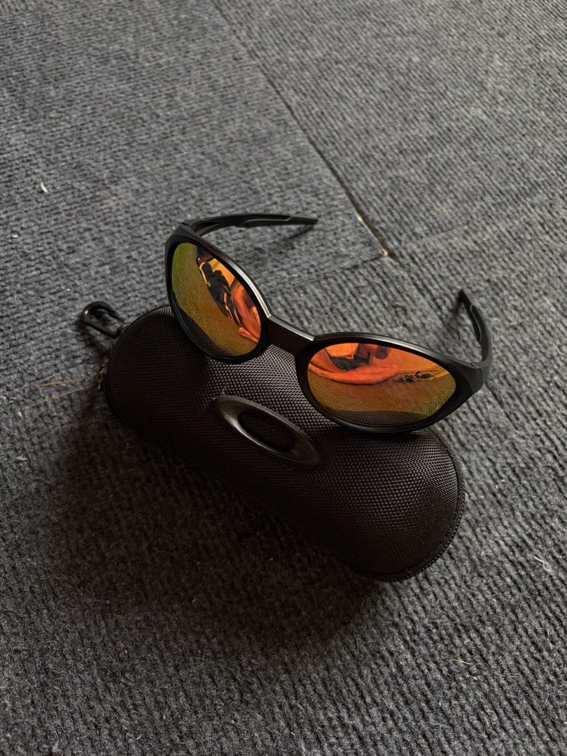 Oakley Jacket (inspired) Sunglasses (Category: Sunglasses & Eyewear) located in Manila. Submitted by toys_hats005 (Listing ID 1467960721, Image 2). Description: - Brand: Oakley - Frame Color: Black - Lenses: Reflective orange, clean with no major scratches - Inclusion: Original hard zippered case with metal ellipse logo and carabiner clip - Condition: Ready to wear.