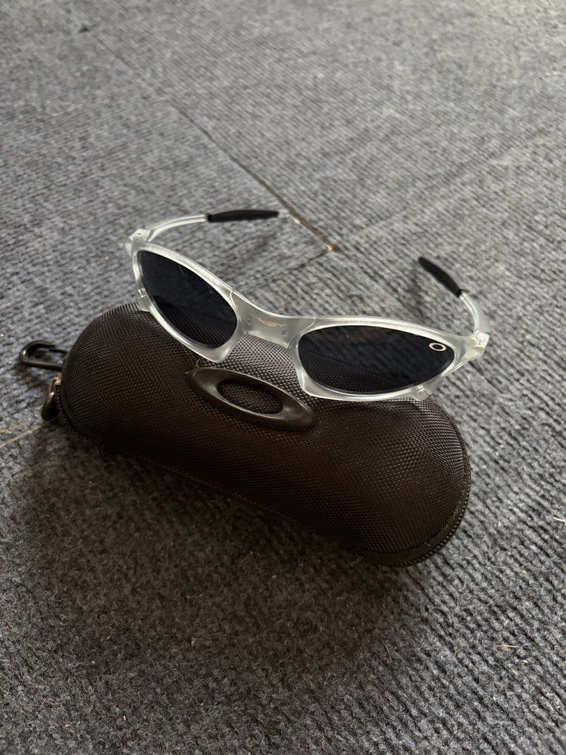 Oakley Juliet Sunglasses (Category: Sunglasses & Eyewear) located in Manila. Submitted by toys_hats005 (Listing ID 1467959261, Image 2). Description: - Brand: Oakley - Frame: Translucent clear with distinct aerodynamic lines - Lenses: Dark lenses, ideal for sunny days and outdoor sports - Inclusion: Original black textured zip hard case with classic ellipse logo - Condition: Excellent.