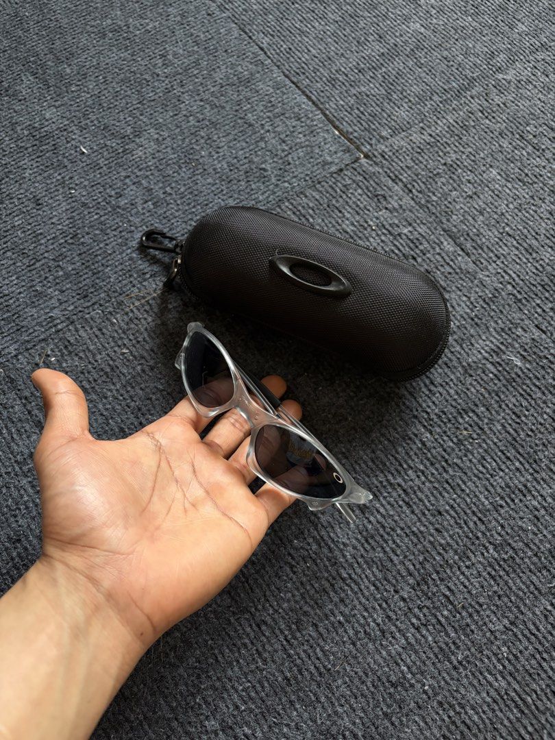 Oakley Juliet Sunglasses (Category: Sunglasses & Eyewear) located in Manila. Submitted by toys_hats005 (Listing ID 1467959261, Image 3). Description: - Brand: Oakley - Frame: Translucent clear with distinct aerodynamic lines - Lenses: Dark lenses, ideal for sunny days and outdoor sports - Inclusion: Original black textured zip hard case with classic ellipse logo - Condition: Excellent.