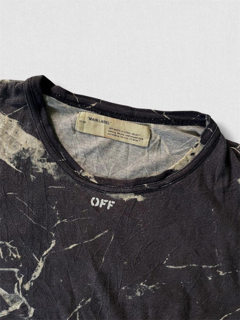 Off-White c/o Virgil Abloh Bleach Marble Tee (Category: Tshirts & Polo Shirts ) located in Cebu City. Submitted by northdrip.threadd (Listing ID 1467903580, Image 3). Description: Off-White c/o Virgil Abloh marble print tee in black and off-white. Short sleeves, crew neck collar. Main Label tag stitched inside the neckline. Vancouver store address print on the lower front. Iconic diagonal arrows sprayed graphic on the back. Regular fit cotton con