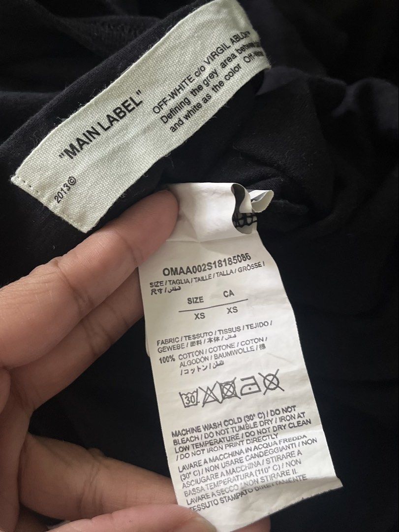 Off-White Fahrenheit 451 Black Tee (Category: Tshirts & Polo Shirts ) located in Naga. Submitted by rmapprl (Listing ID 1467944628, Image 3). Description: - Off-White black t-shirt designed by Virgil Abloh - Features iconic Fahrenheit 451 graphic and signature yellow diagonal arrows on the back - Subtle OFF logo text on the front collar - Tagged size XS, but fits oversized up to a Large (22 x 27 inches) - Premium 100% cotton construction, Made in